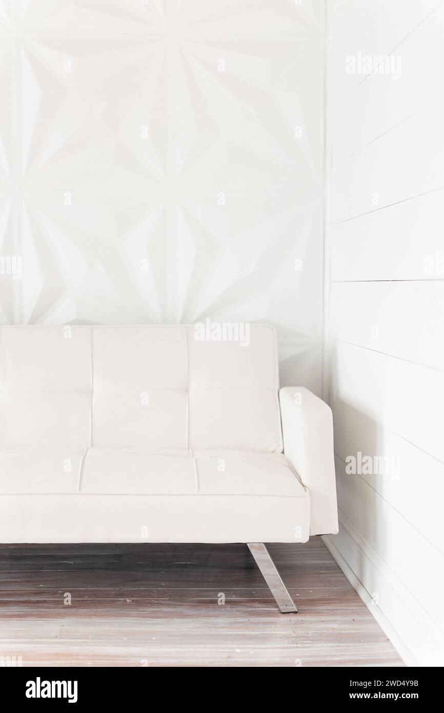 White couch near windows in room with wood flooring Stock Photo Alamy