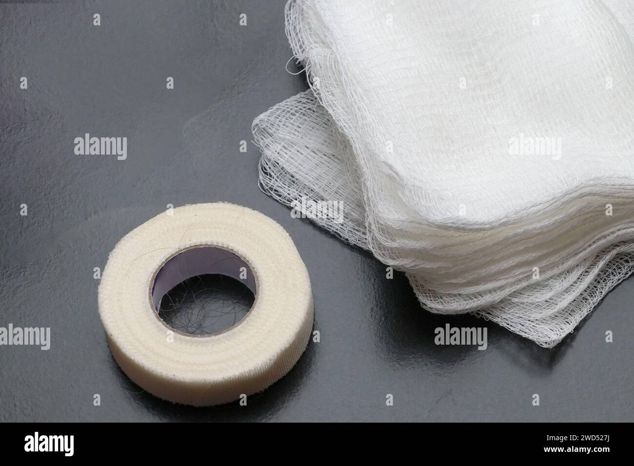 A Gauze pads and tape used to control bleeding for first aid Stock Photo Alamy