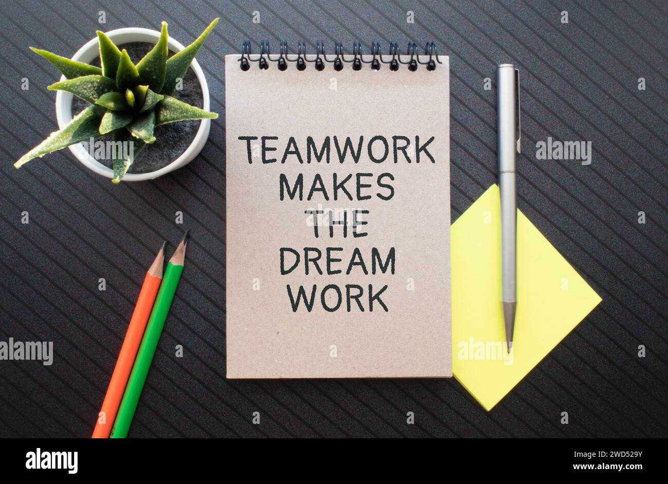 TMDW Teamwork makes dream work symbol. Concept words TMDW Teamwork makes dream work on white note on beautiful wooden background. Business TMWD teamwo Stock Photo