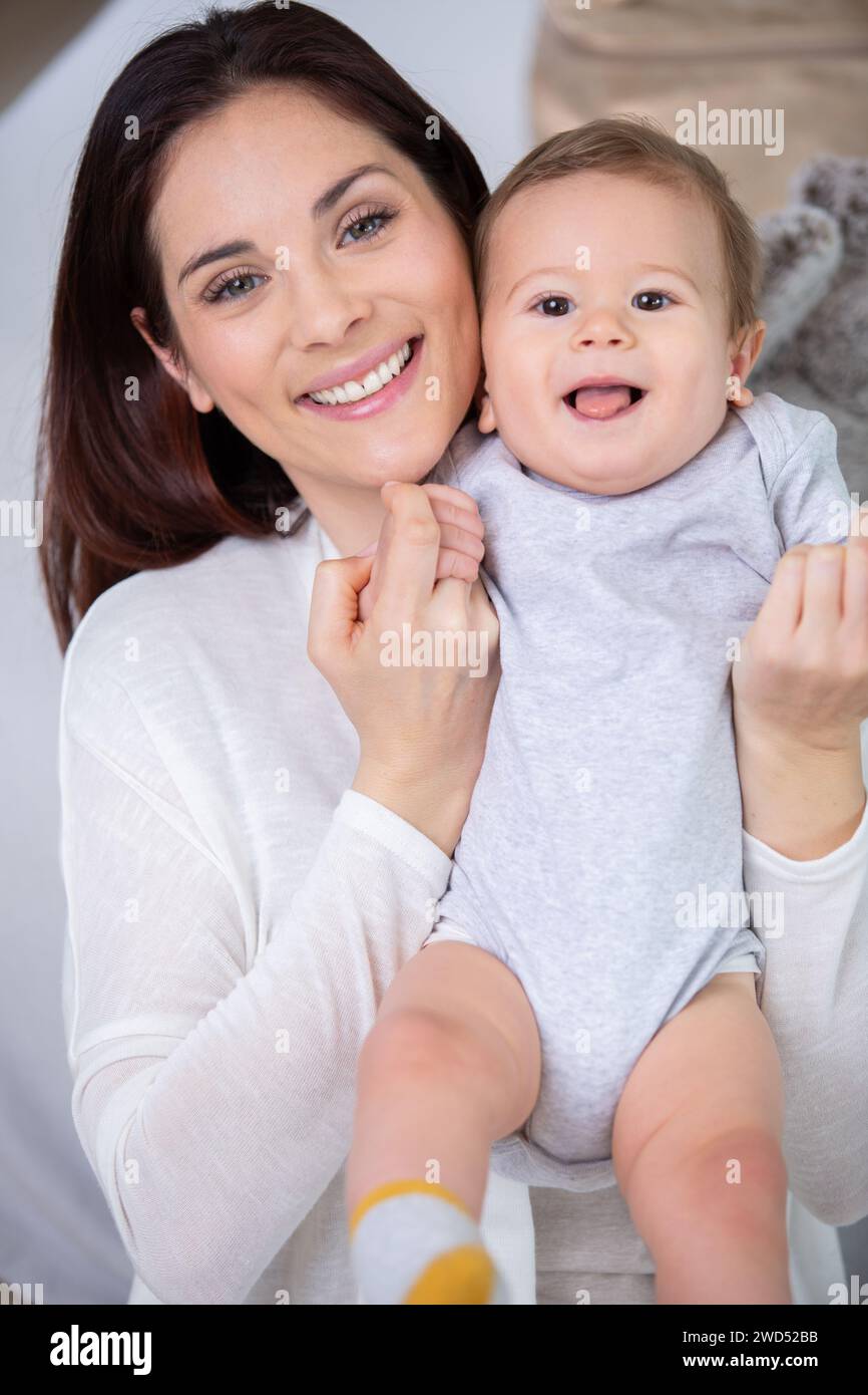 home portrait of a baby boy with mother Stock Photo