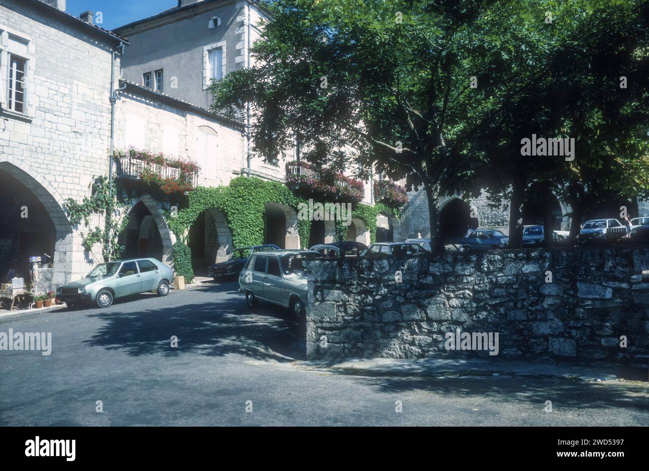 1986 archive image of south west corner of Place des Arcades in Monflanquin, Lot-et-Garonne, France. Stock Photo