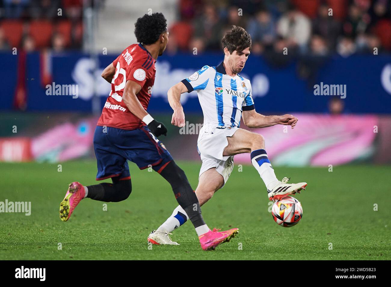 Aritz Elustondo of Real Sociedad duels for the ball with Johan Mojica of CA Osasuna during the Copa El Rey match between CA Osasuna and Real Sociedad Stock Photo