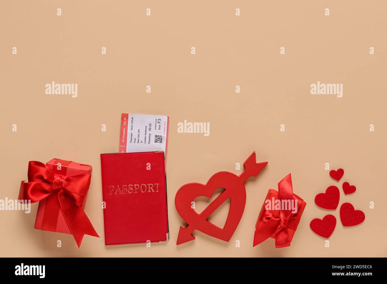 Passport with ticket, gifts and hearts on beige background. Valentine's