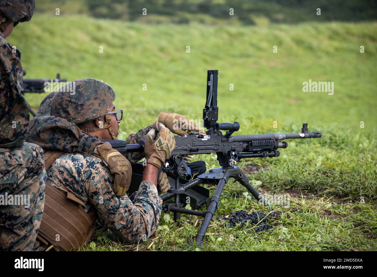 U.S. Marines with Marine Wing Support Squadron (MWSS) 174, Marine Aircraft Group 24, 1st Marine Aircraft Wing, fire M240-B and M2 .50-caliber machine guns at the Marine Corps Air Station Kaneohe Bay range, Hawaii, Jan. 16, 2024. The training provided an opportunity for Marines with MWSS-174 to get hands-on training and familiarization with the employment of crew-served weapons. (U.S. Marine Corps photo by Lance Cpl. Logan Beeney) Stock Photo