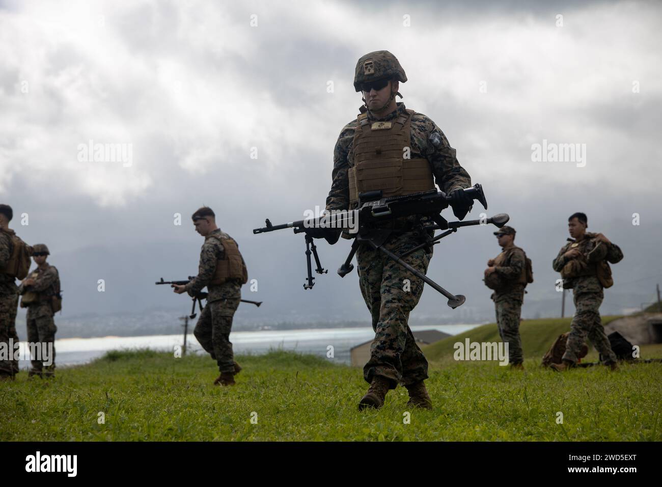 U.S. Marines with Marine Wing Support Squadron (MWSS) 174, Marine Aircraft Group 24, 1st Marine Aircraft Wing, prepare to fire M240-B and M2 .50-caliber machine guns at the Marine Corps Air Station Kaneohe Bay range, Hawaii, Jan. 16, 2024. The training provided an opportunity for Marines with MWSS-174 to get hands-on training and familiarization with the employment of crew-served weapons. (U.S. Marine Corps photo by Lance Cpl. Logan Beeney) Stock Photo