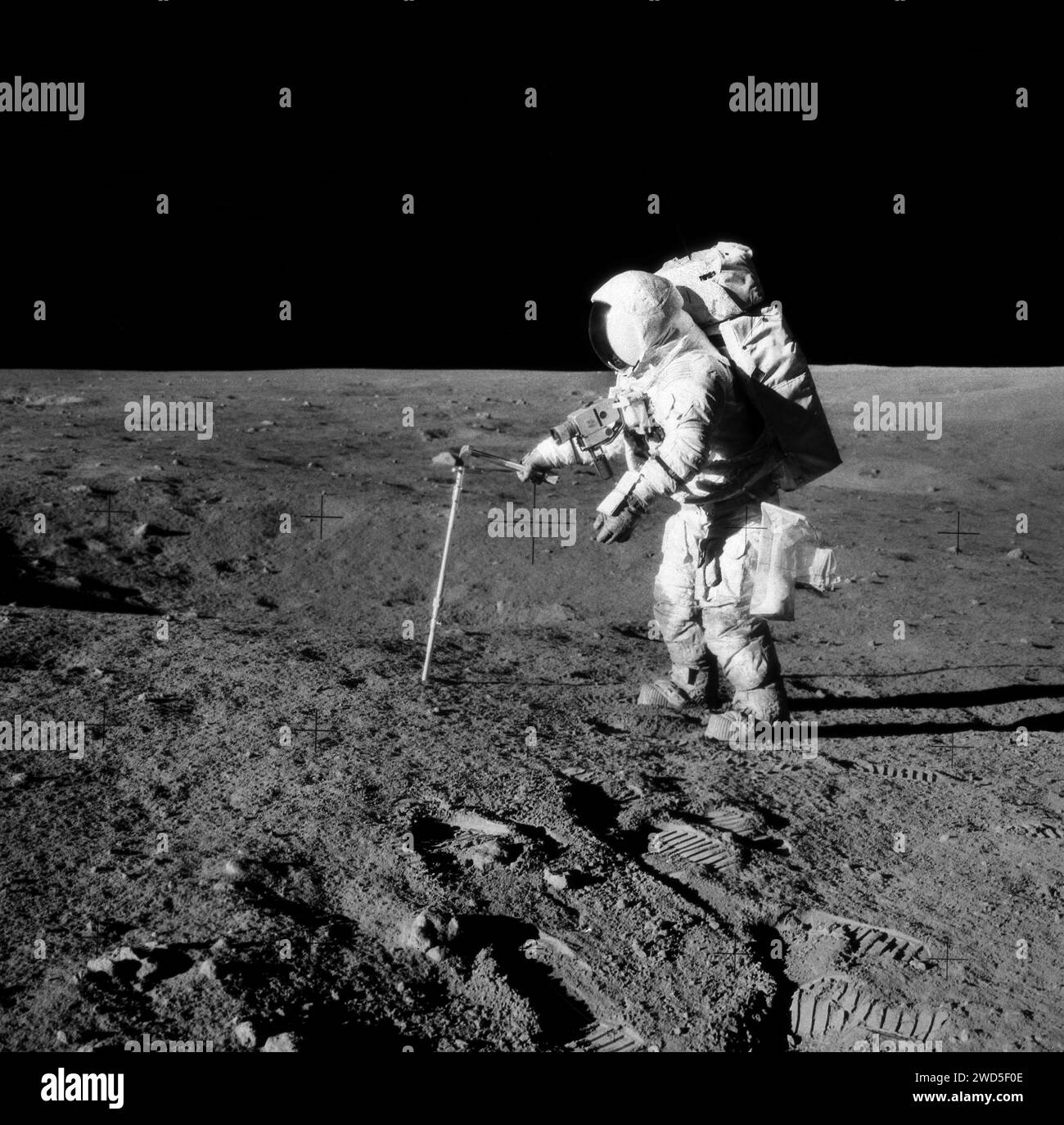 American astronaut Alan L. Bean, lunar module pilot, driving core sample tube into lunar surface during Apollo 12 extravehicular activity, Johnson Space Center, NASA, November 20, 1969 Stock Photo