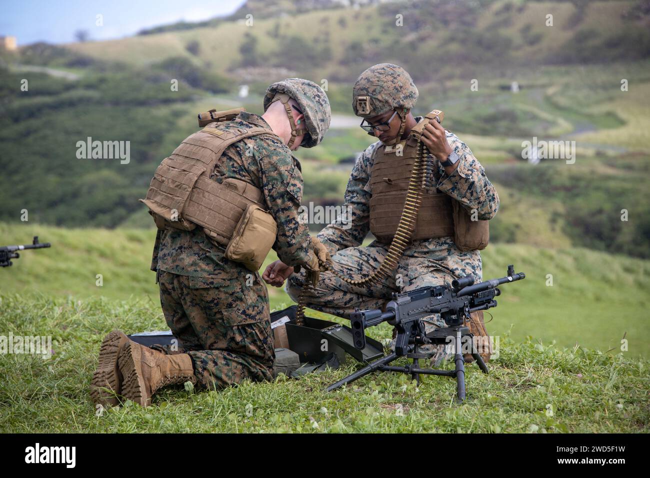 U.S. Marines with Marine Wing Support Squadron (MWSS) 174, Marine Aircraft Group 24, 1st Marine Aircraft Wing, prepare to fire M240-B and M2 .50-caliber machine guns at the Marine Corps Air Station Kaneohe Bay range, Hawaii, Jan. 16, 2024. The training provided an opportunity for Marines with MWSS-174 to get hands-on training and familiarization with the employment of crew-served weapons. (U.S. Marine Corps photo by Lance Cpl. Logan Beeney) Stock Photo