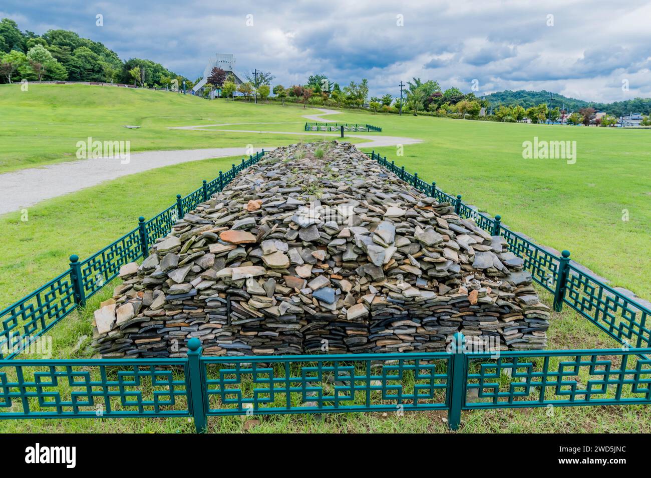 Collection of roof shingles excavated at archaeological site inside iron fence, South Korea, South Korea Stock Photo