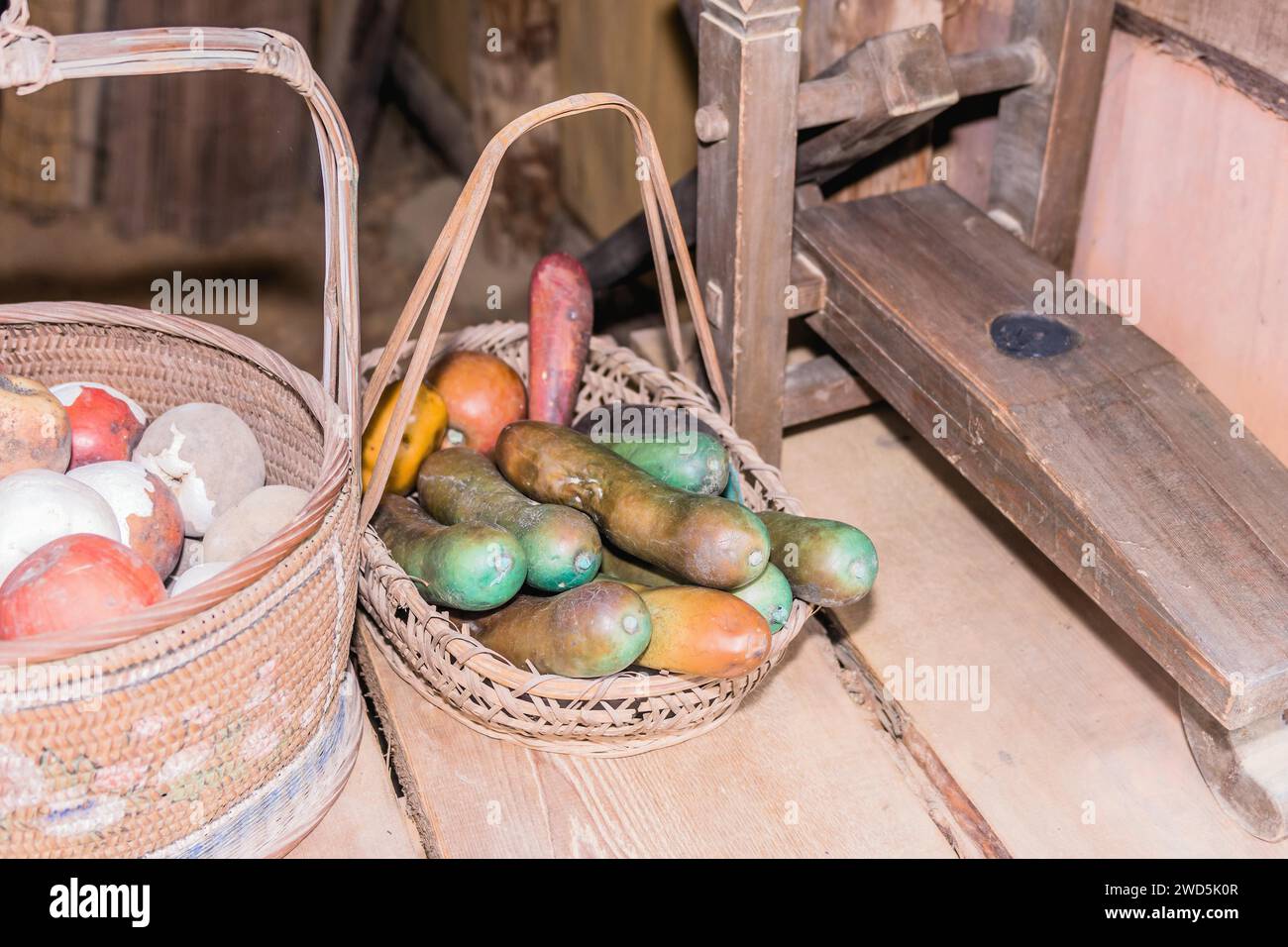 Imitation vegetables in wicker basket on wooden table, South Korea, South Korea Stock Photo