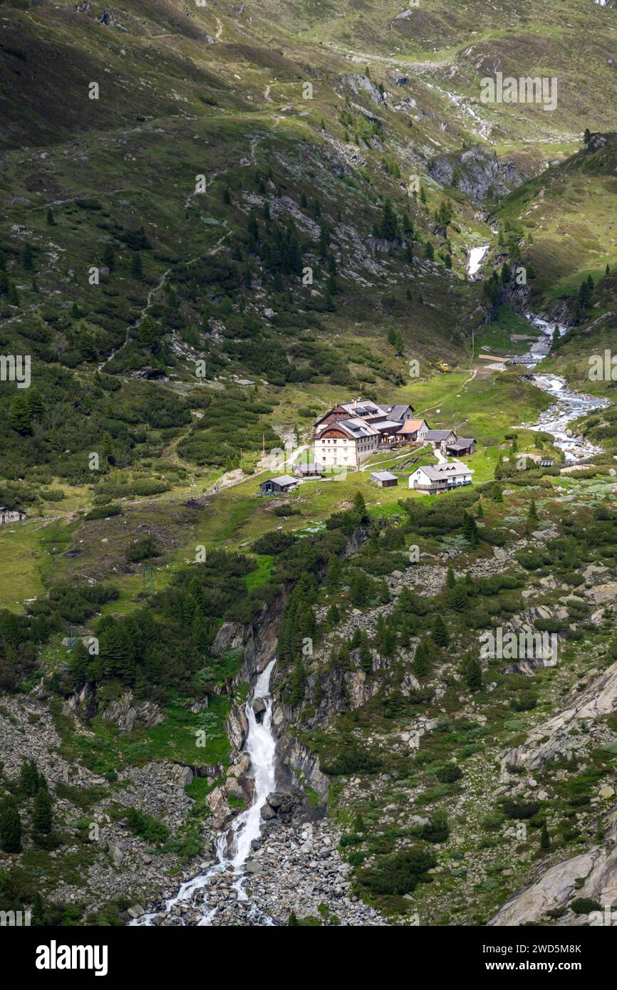 View of mountain hut Berliner Huette with Zemmbach stream in the Zemmgrund valley, Berliner Hoehenweg, Zillertal Alps, Tyrol, Austria Stock Photo
