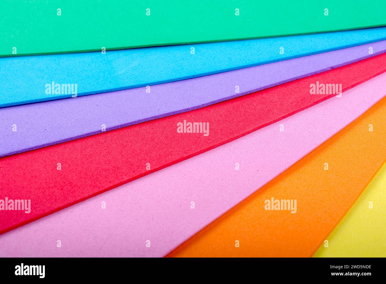 Colorful objects make mixed multi color background Stock Photo - Alamy