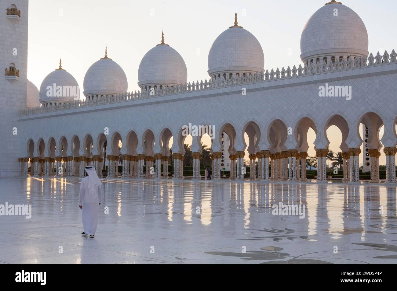 An arab citizen walks by the courtyard, Abu Dhabi, United Arab Emirates Stock Photo