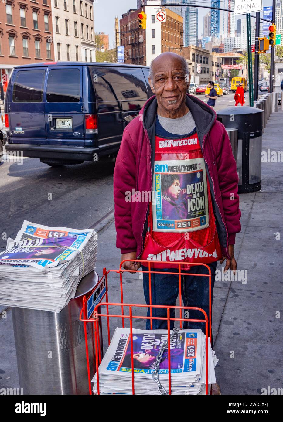 New York City Newstand Worker Wears Vest Reporting Prince Rogers Nelson's Death Stock Photo