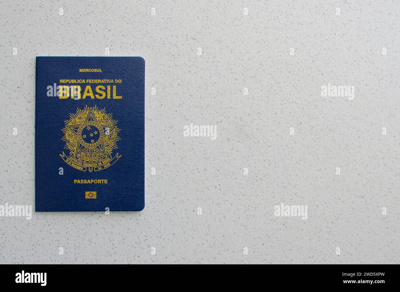 Detailed view of the blue and golden cover of the Brazilian passport