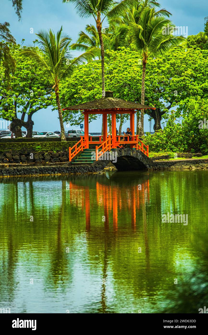 Bridge and reflections in Liliuokelani Park & Gardens in Hilo Hawaii Stock Photo