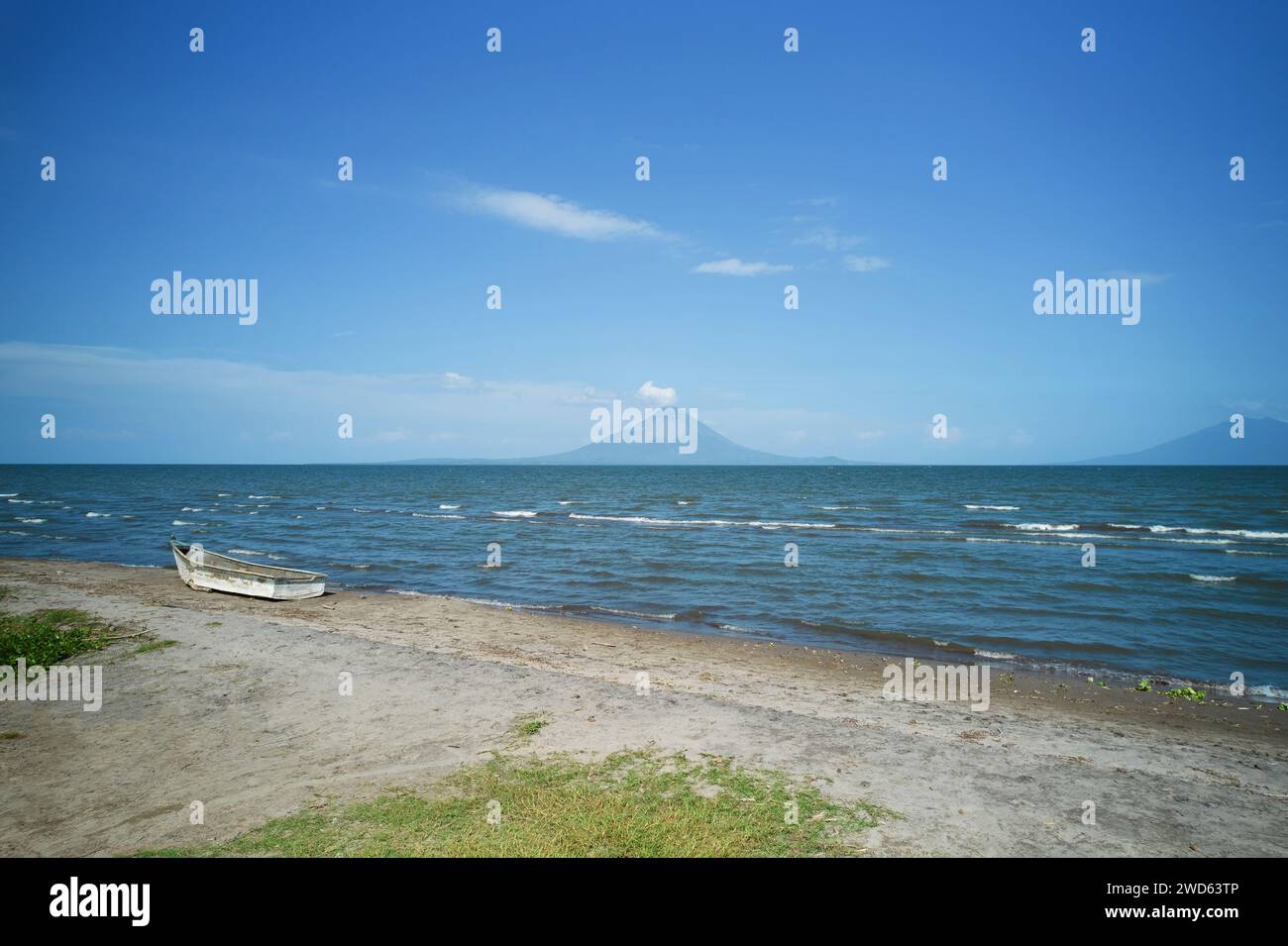 Shore of Ometepe lake with Volcano on bright sunny day Stock Photo