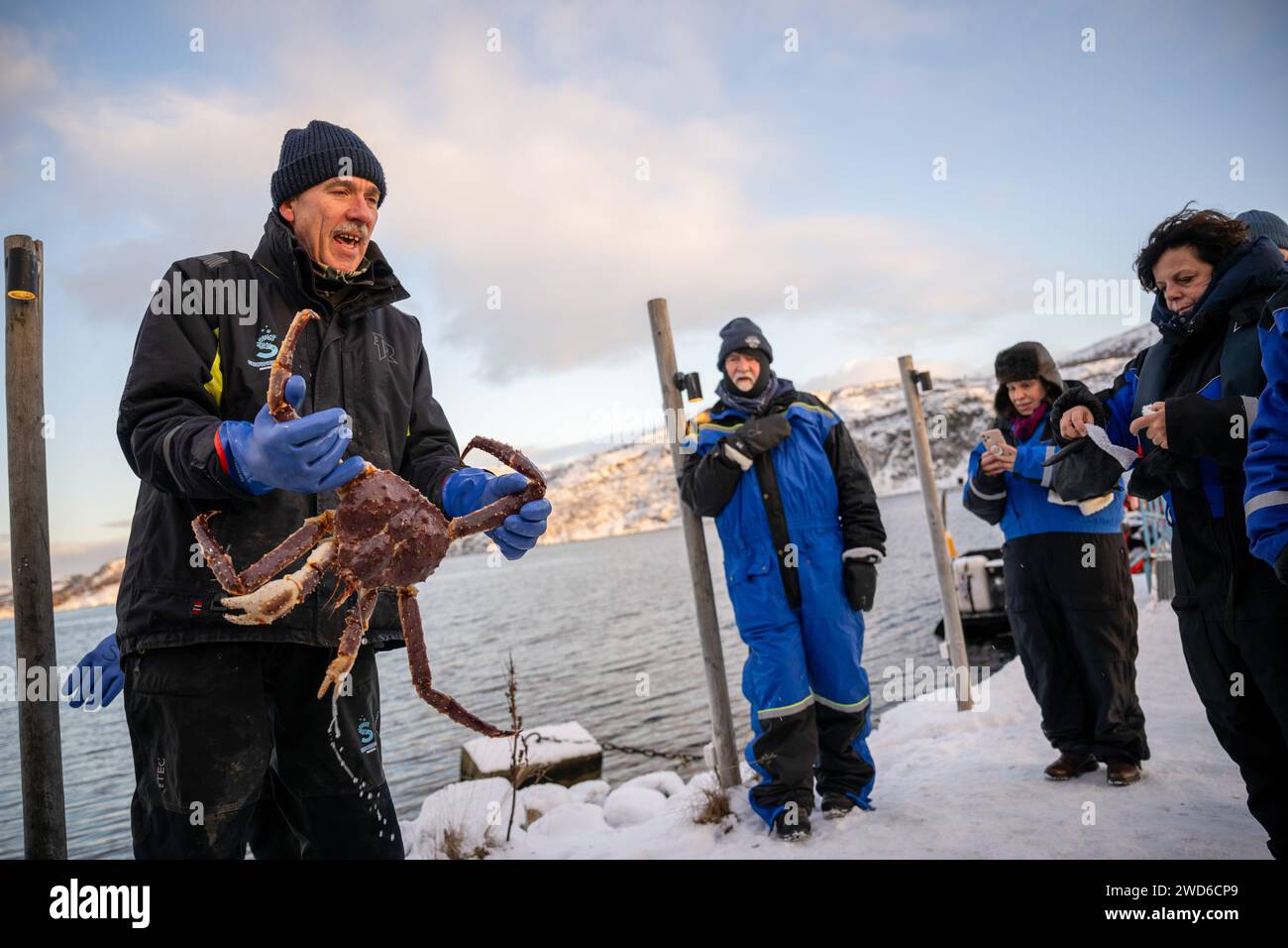 Kirkenes, Troms Og Finnmark, Norway. 13th Jan, 2024. A fisherman shows