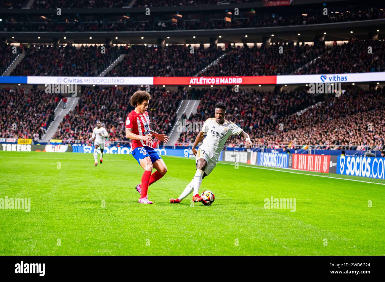 Madrid, Spain. 18th Jan, 2024. Vinicius Junior (R) of Real Madrid and Axel Witsel (L) of Atletico Madrid during the football match valid for the round of 16 of the Copa del Rey tournament between Atletico Madrid and Real Madrid played at Estadio Metropolitano in Madrid, Spain. Atletico Madrid 4 : 2 Real Madrid Credit: SOPA Images Limited/Alamy Live News Stock Photo