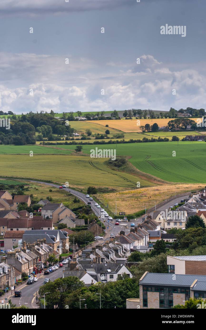 An aerial view of a rural town nestled amidst picturesque fields and ...