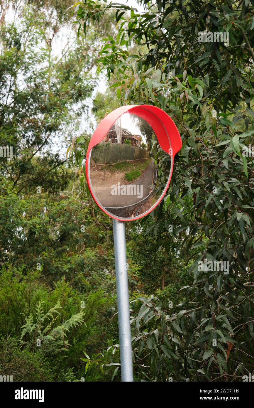 Convex safety mirror on a walking path so people can see what's coming ...