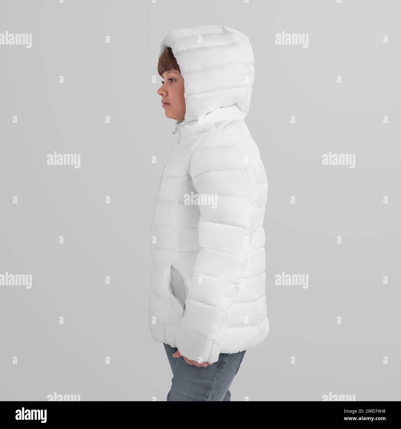 Mockup of a winter warm jacket on a girl in a hood, side view. Outerwear template for design, branding, commercial use. Children's clothing for outdoo Stock Photo