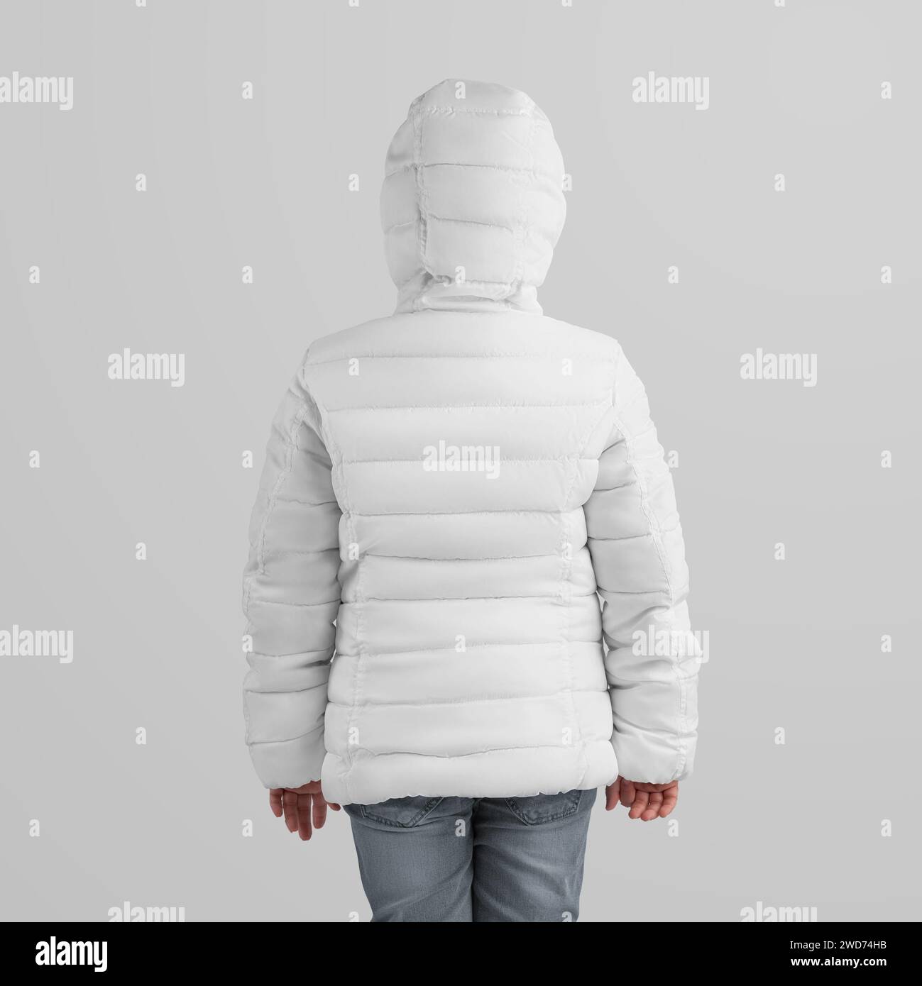 Winter warm jacket template on a girl in a hood, rear view, isolated on a background. Mockup of stylish outerwear for design, branding, commerce. Kids Stock Photo