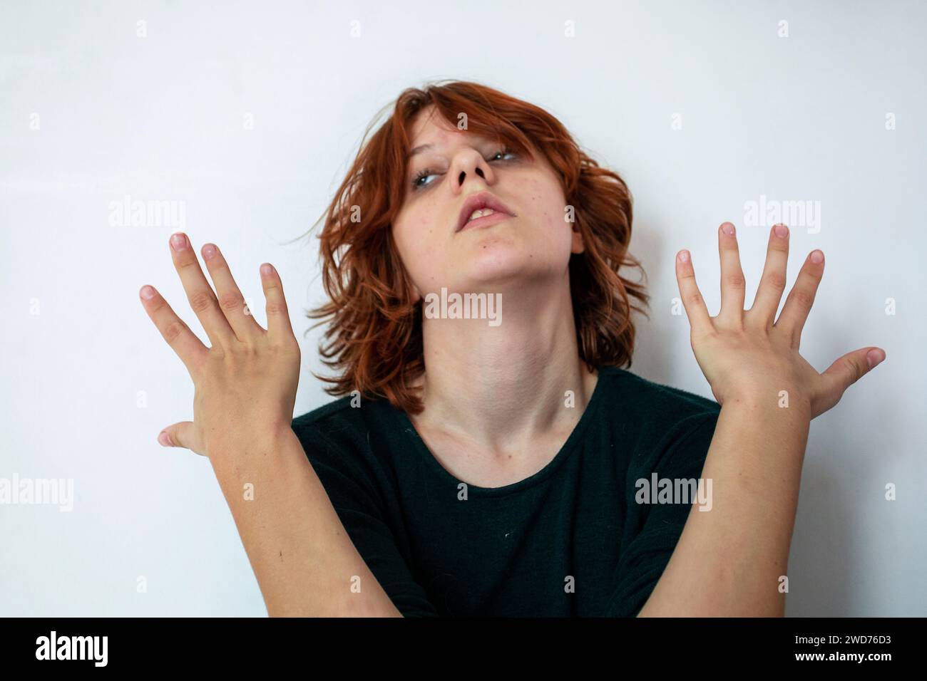 beautiful teenage girl with a stylish short anime hairstyle on a light background Stock Photo