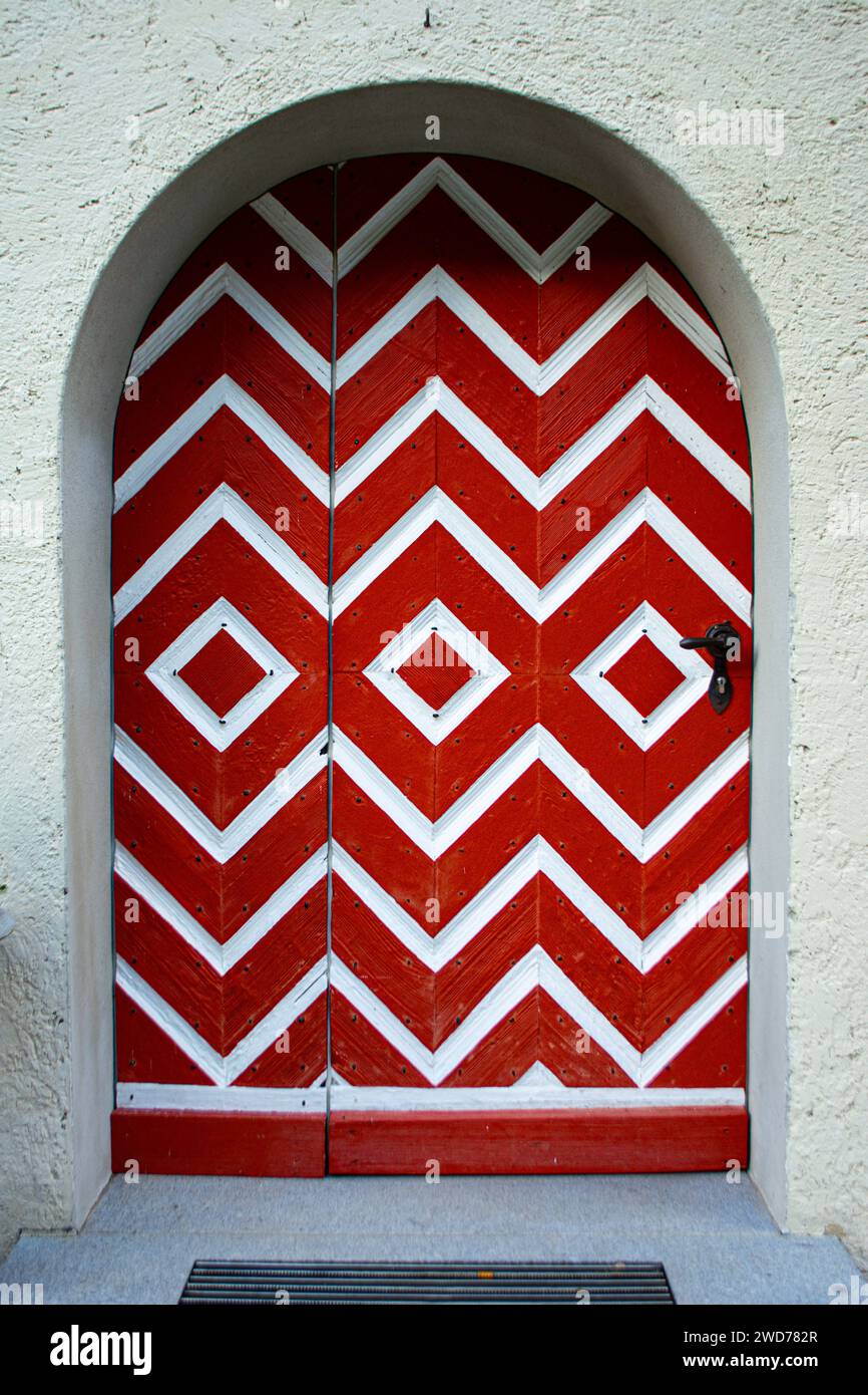 Red and white door of the upper castle in Feldkirch, Austria Stock Photo
