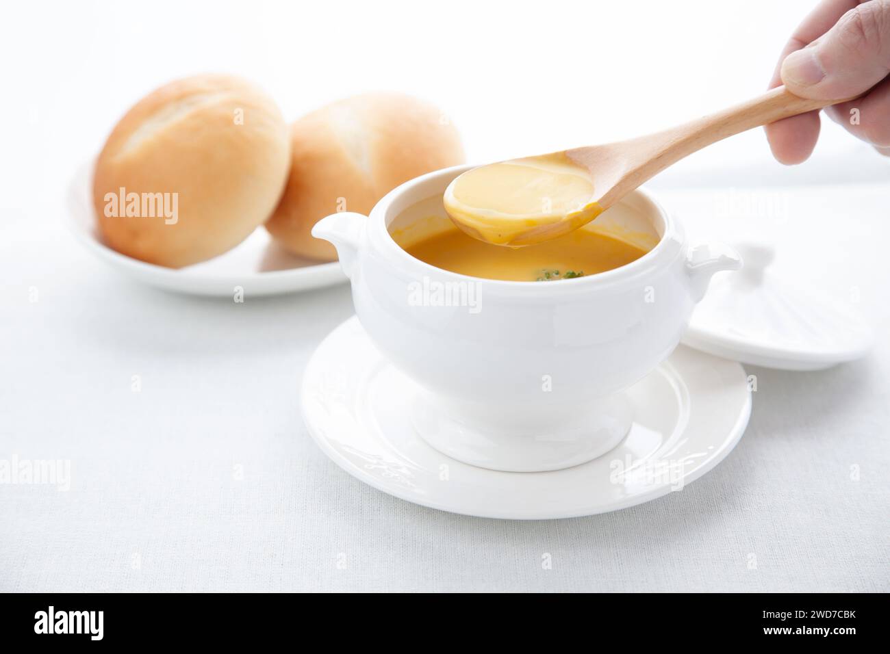 pumpkin potage soup isolated on table Stock Photo