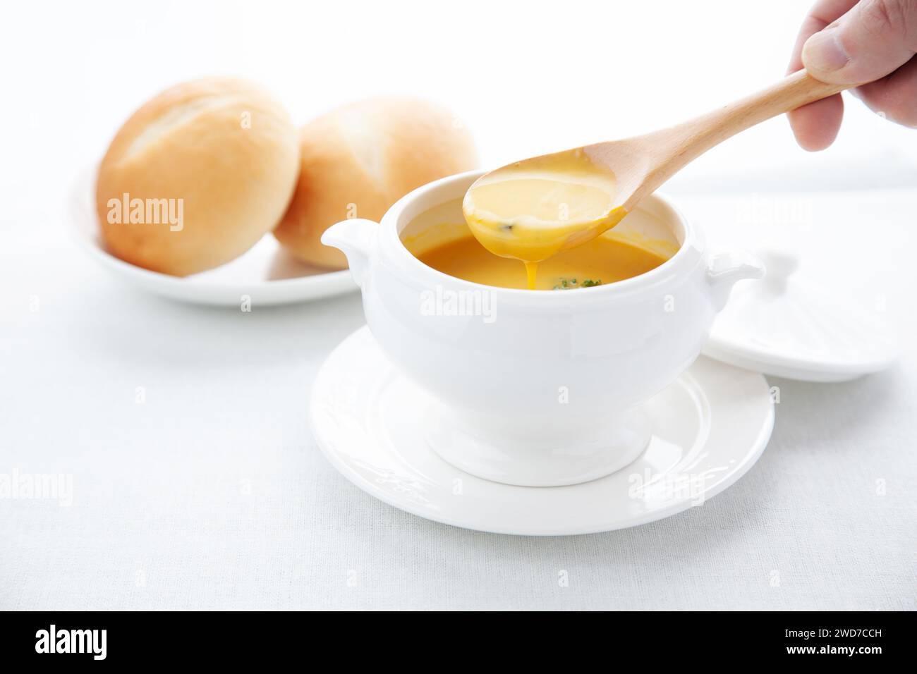 pumpkin potage soup isolated on table Stock Photo