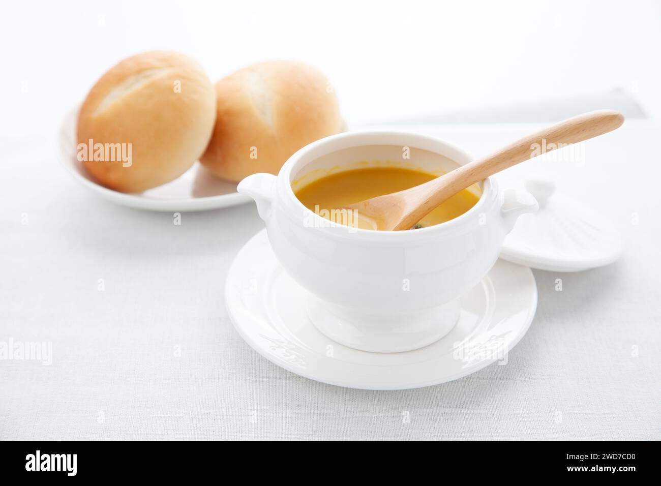 pumpkin potage soup isolated on table Stock Photo