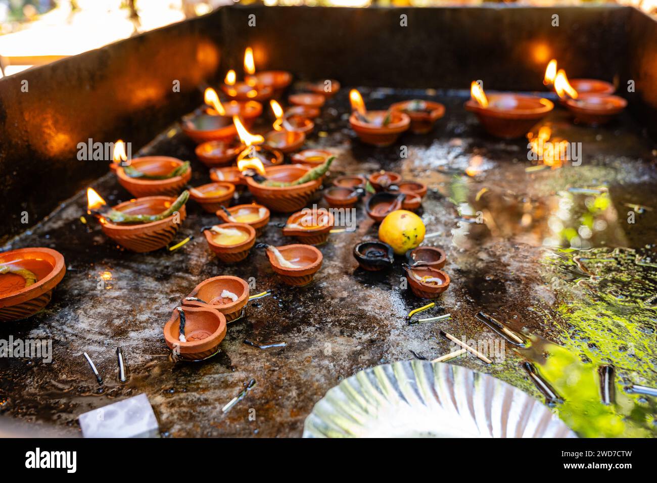 Glowing Deepams Illuminate a Hindu Temple's Stock Photo