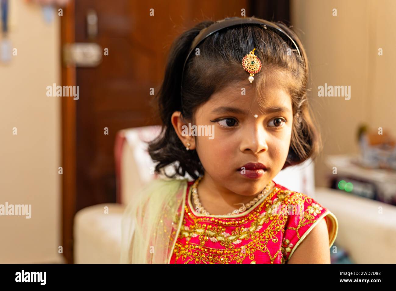 Capture the essence of youthful charm in this close-up portrait of an Indian girl Stock Photo