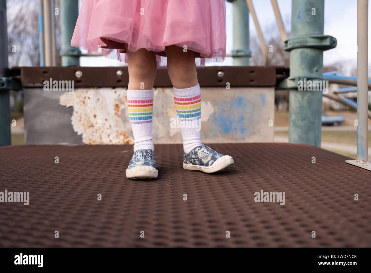 A Childs Stylish Outfit Playing At The Playground In Tulsa Stock Photo