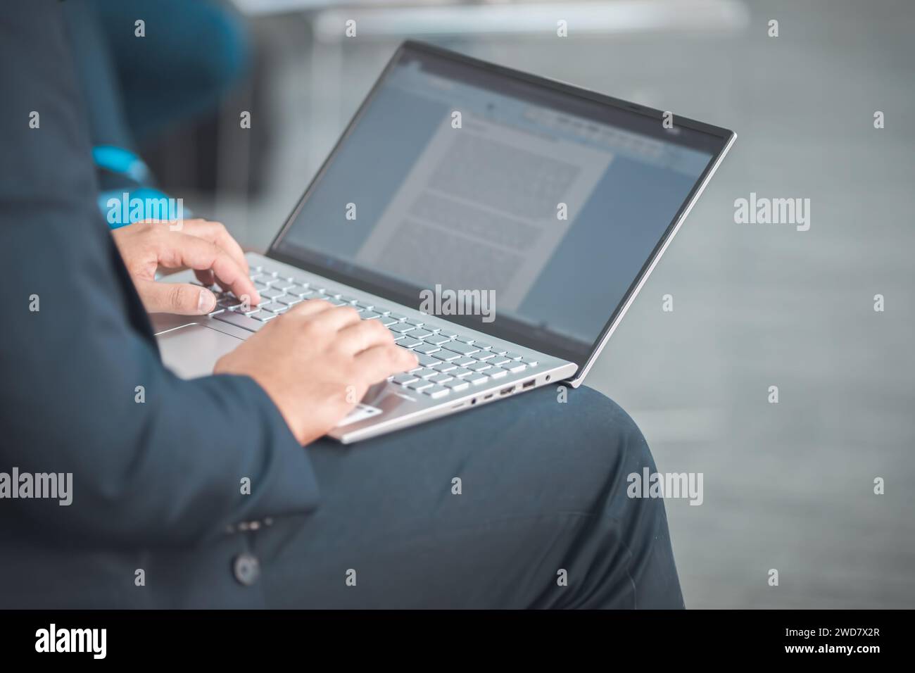 closeup of man using a laptop taking notes during a seminar presentation event Stock Photo