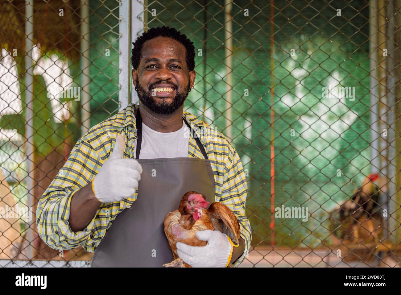 african male farmer worker standing portrait in livestock farm small business owner happy smile Stock Photo