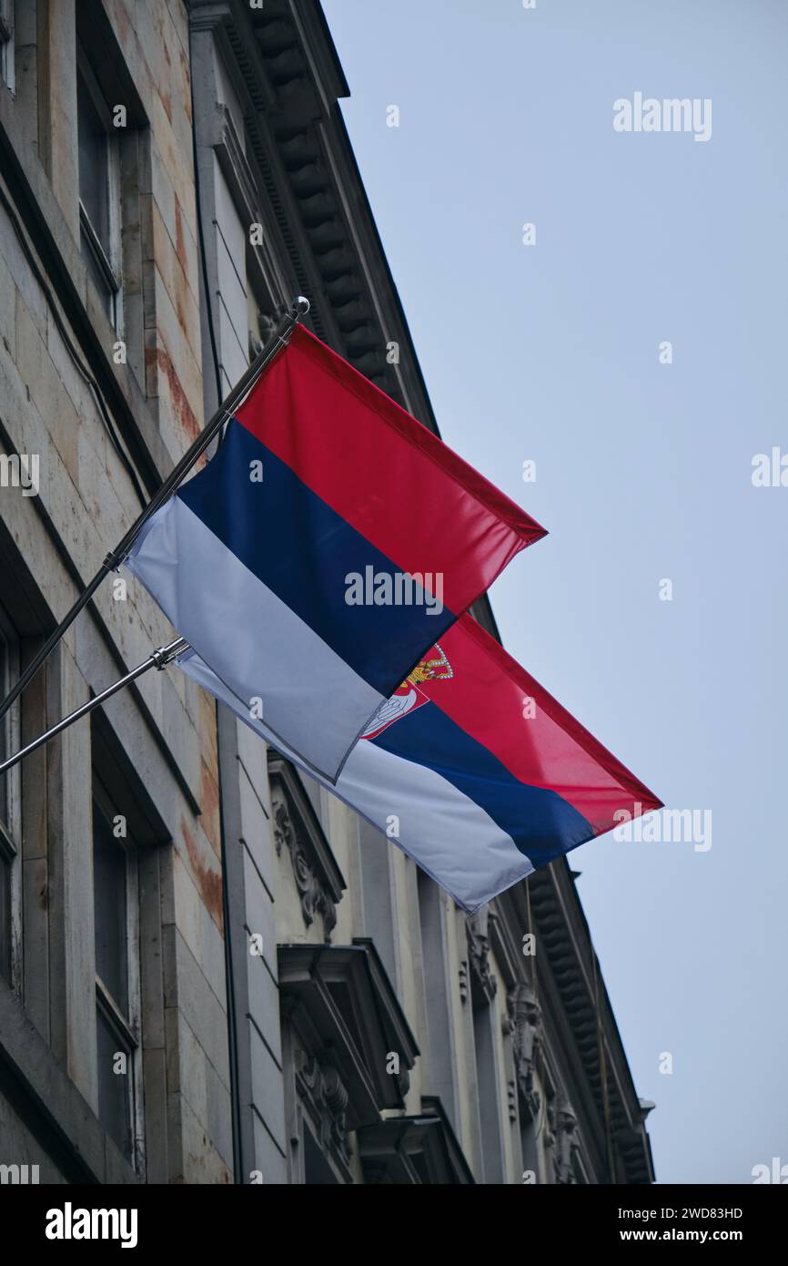 Two Serbian national flags waving on the building in historical center of Belgrade, Serbia Stock Photo