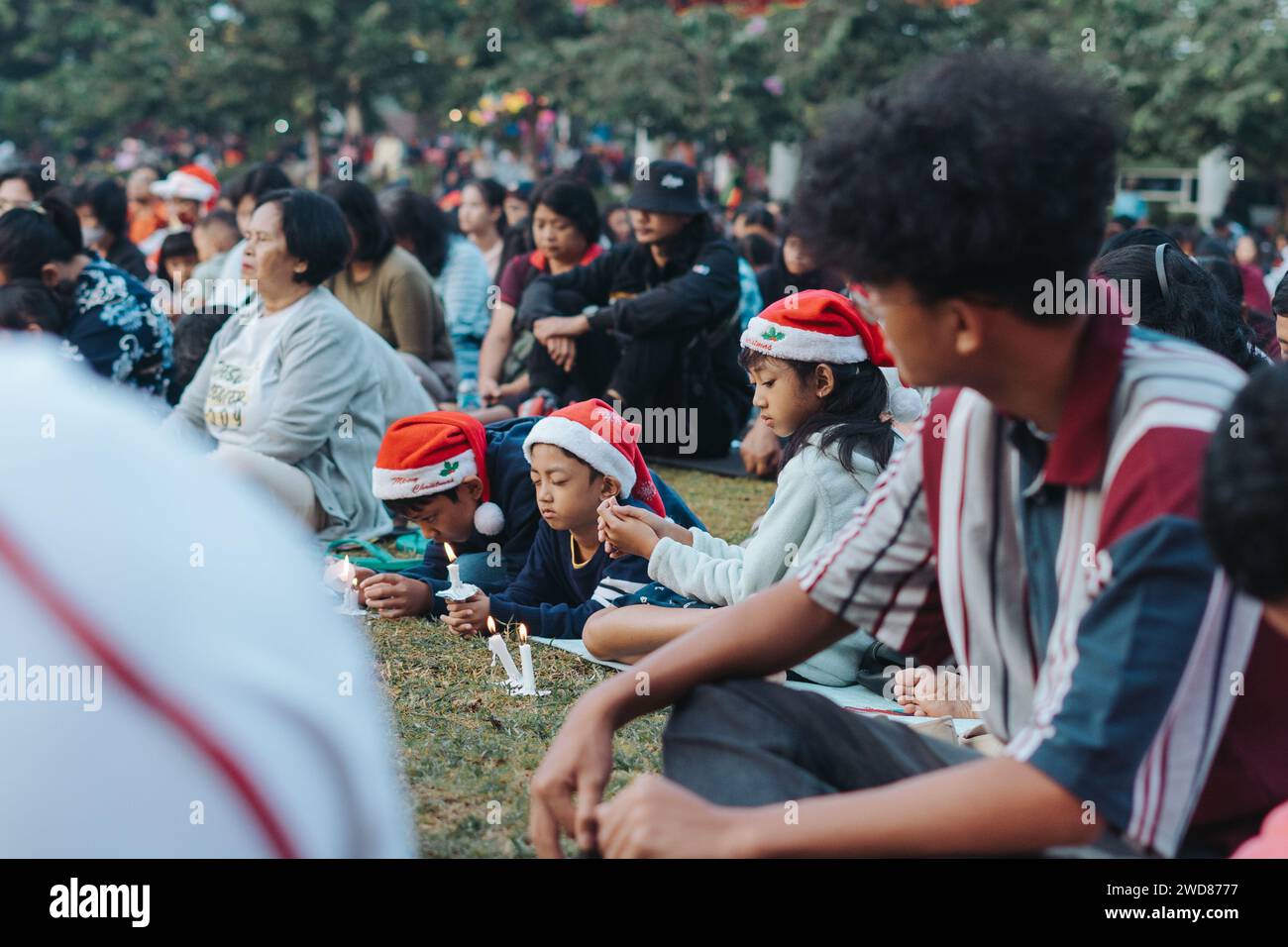 Christians and Catholics praying together celebrating Christmas at Alun-alun Pancasila in Salatiga, Indonesia - December 25, 2023. Stock Photo