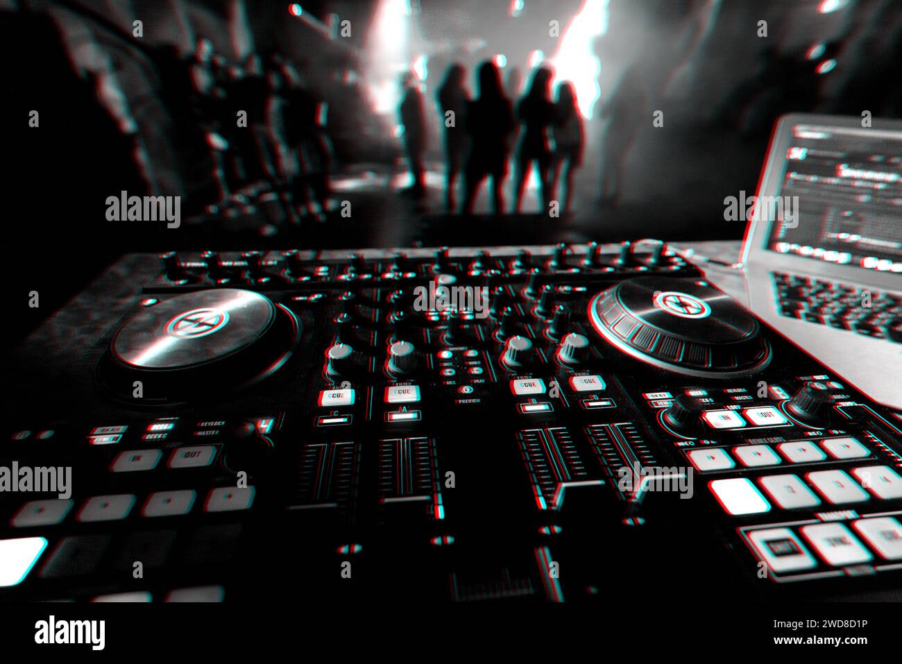 DJ mixer controller Board for professional mixing of electronic music in a nightclub at a party with dancing people in the background. Black and white Stock Photo