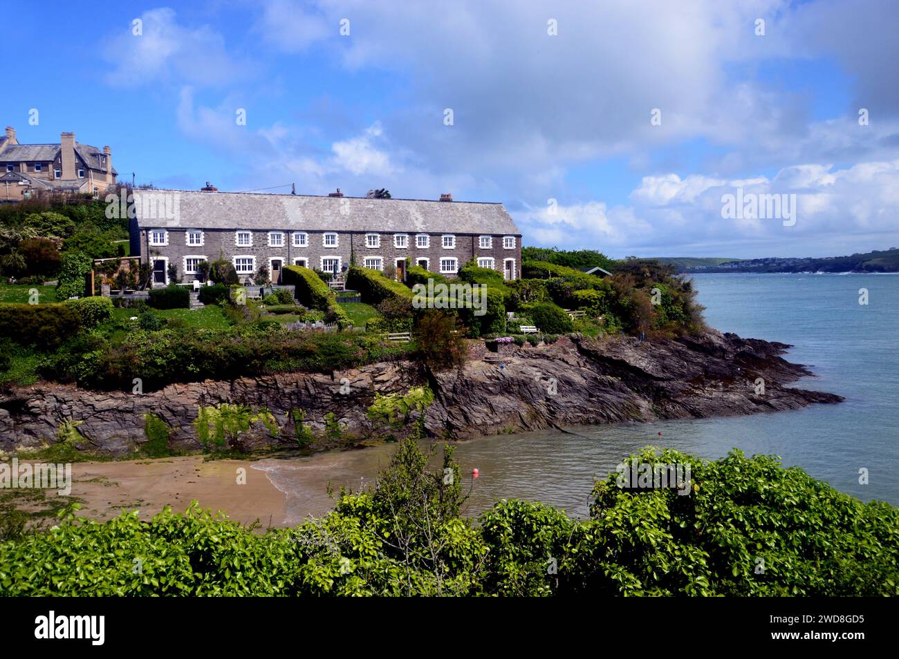 The Old Row of Maritime Pilots Cottages at Hawker's Cove near Padstow on the South West Coastal Path in Cornwall, England, UK. Stock Photo