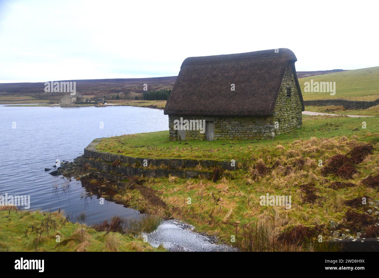 Grimwith High Laithe a  Restored 17th Century Thatched Cruck Barn on the Banks of Grimwith Reservoir in the Yorkshire Dales National Park, England, UK Stock Photo