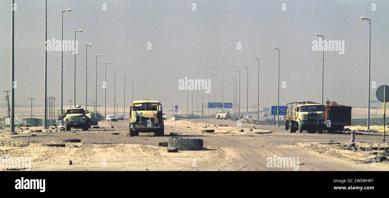 3rd March 1991 Abandoned Iraqi military trucks litter Highway 80 on the western outskirts of Kuwait City. Stock Photo