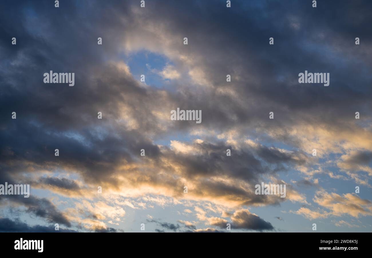 Low angle view to evening sky with dramatic clouds Stock Photo