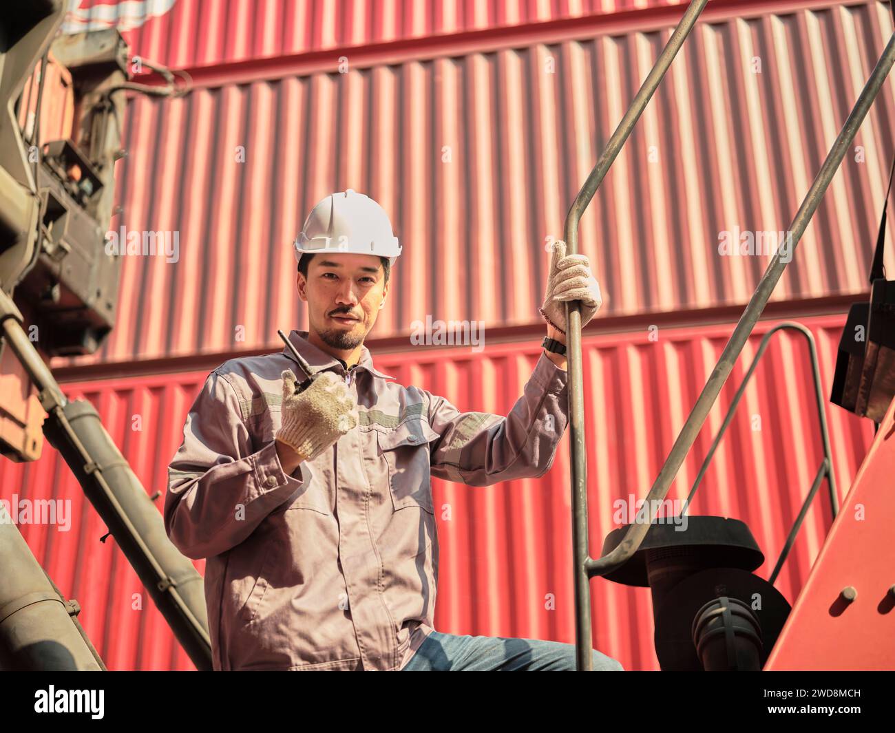 Engineer is pointing controlling the job at the Container cargo