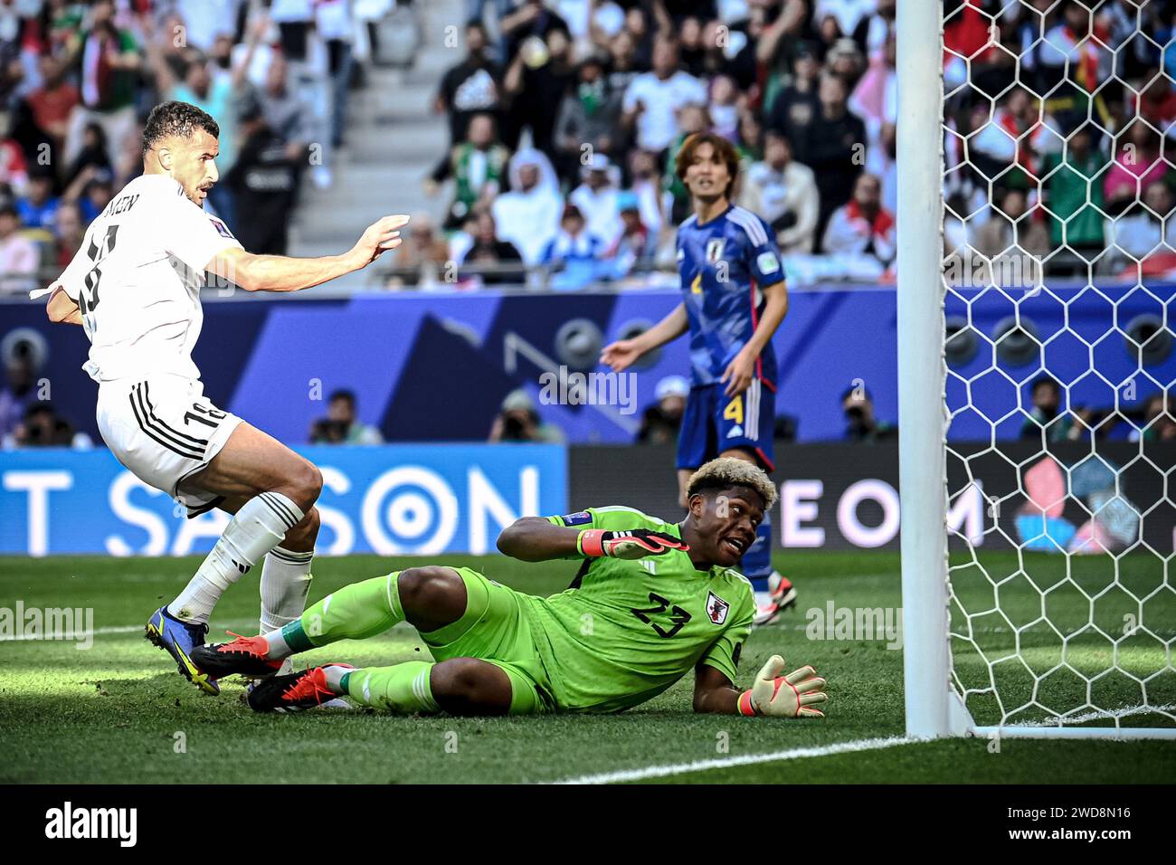 Doha, Qatar. 19th Jan, 2024. Iraq's Aymen Hussein (L) scores during the