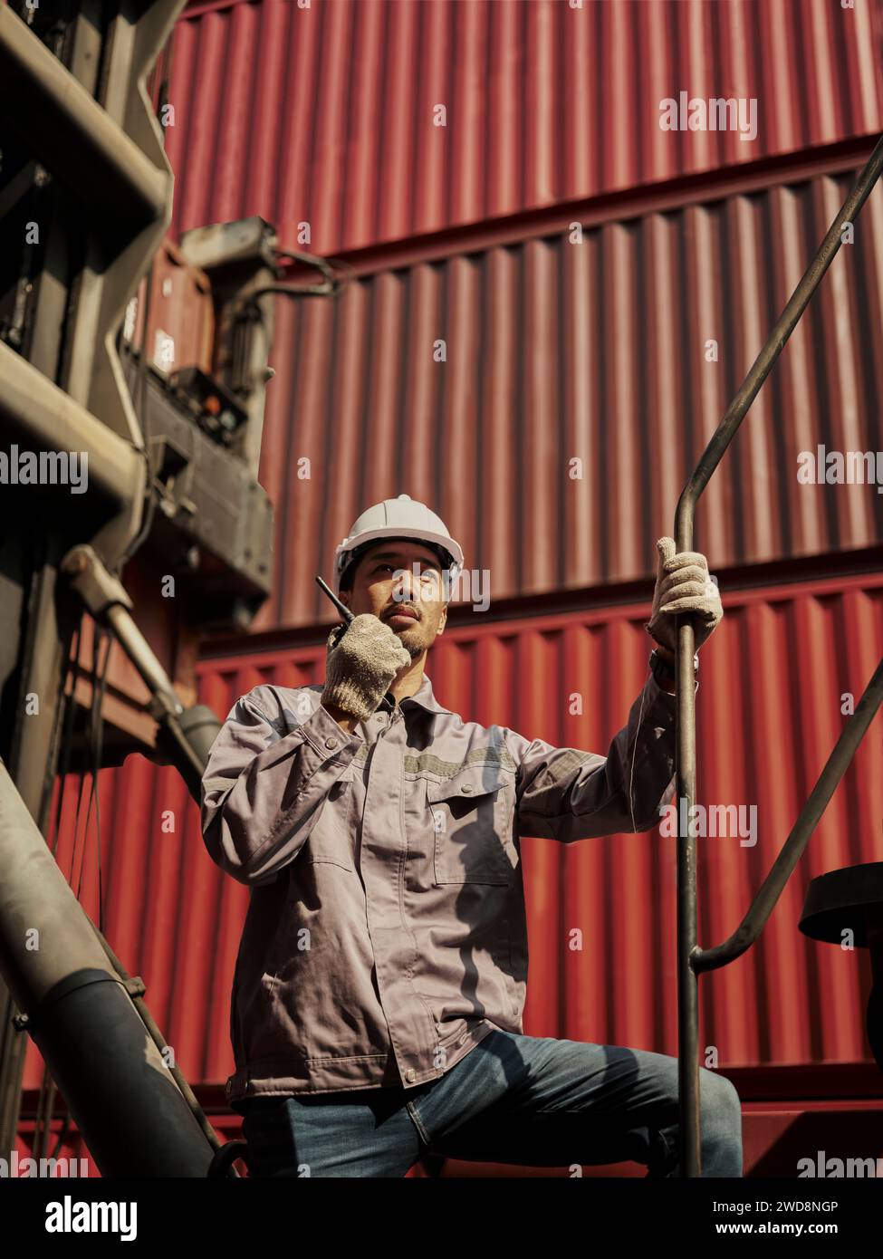 Engineer is pointing controlling the job at the Container cargo