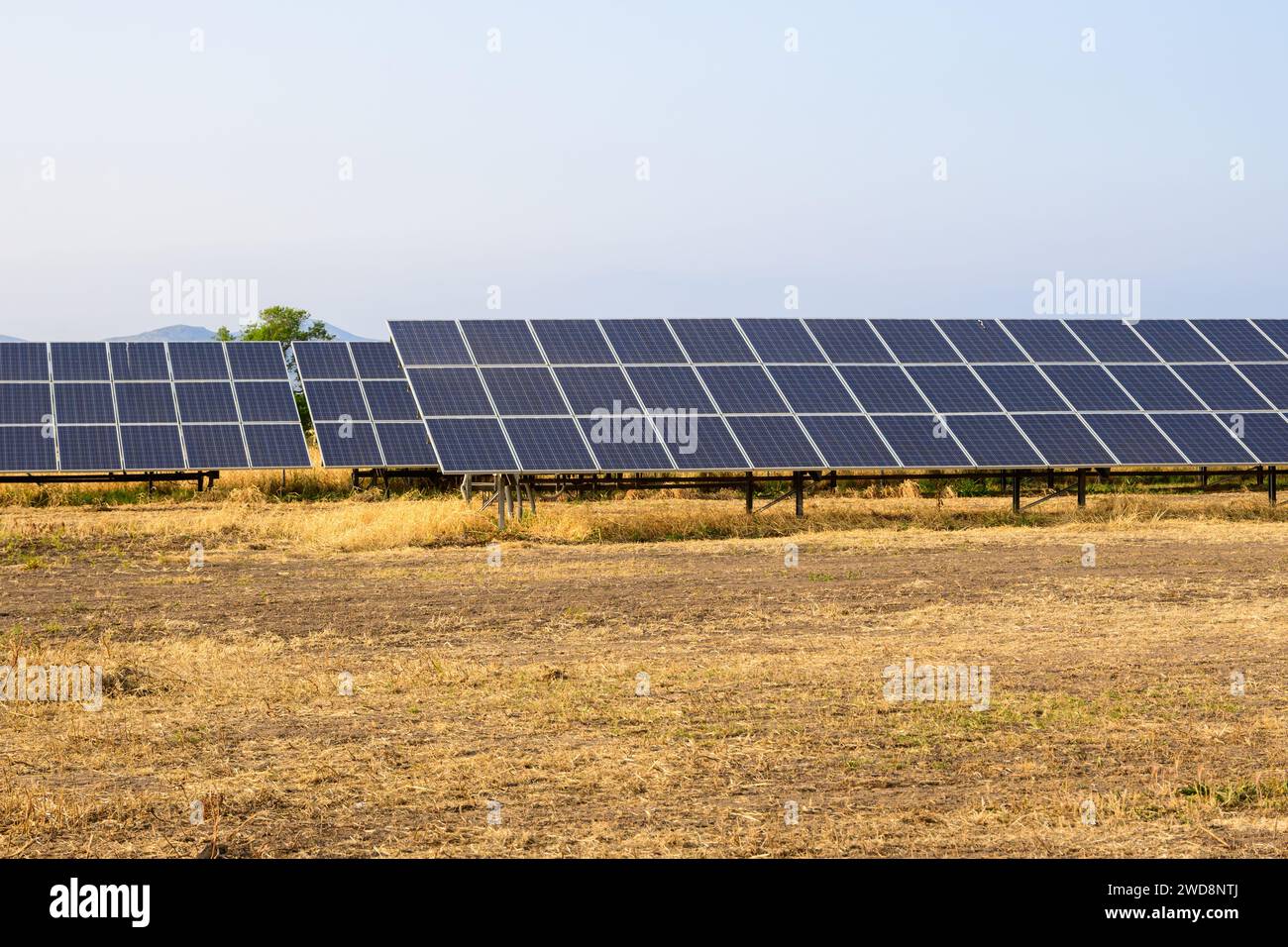 Solar power station with solar panels for producing electric power energy Stock Photo