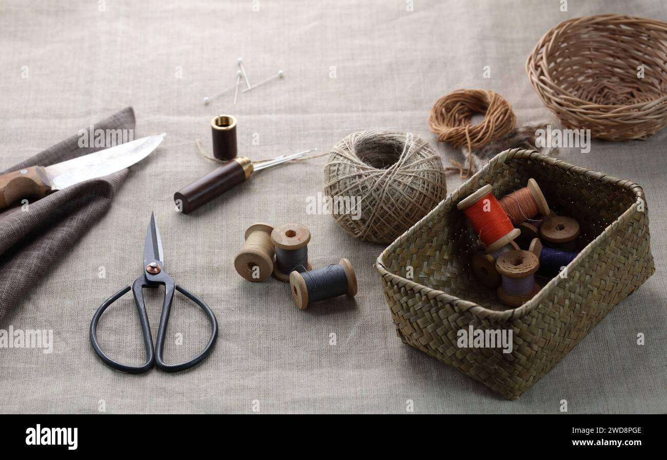 sewing threadswith needles and a trunk for accessories on a canvas Stock Photo