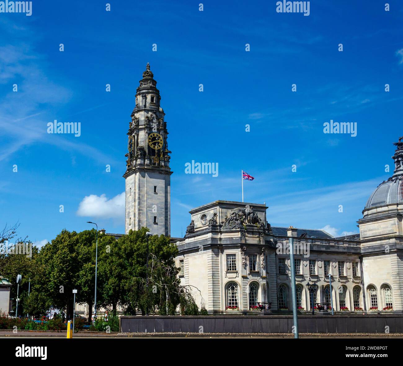 Cardiff, Glamorgan, Wales August 11 2023 - Cardiff City Hall with it's iconic four sided clock tower and gilded clock faces Stock Photo