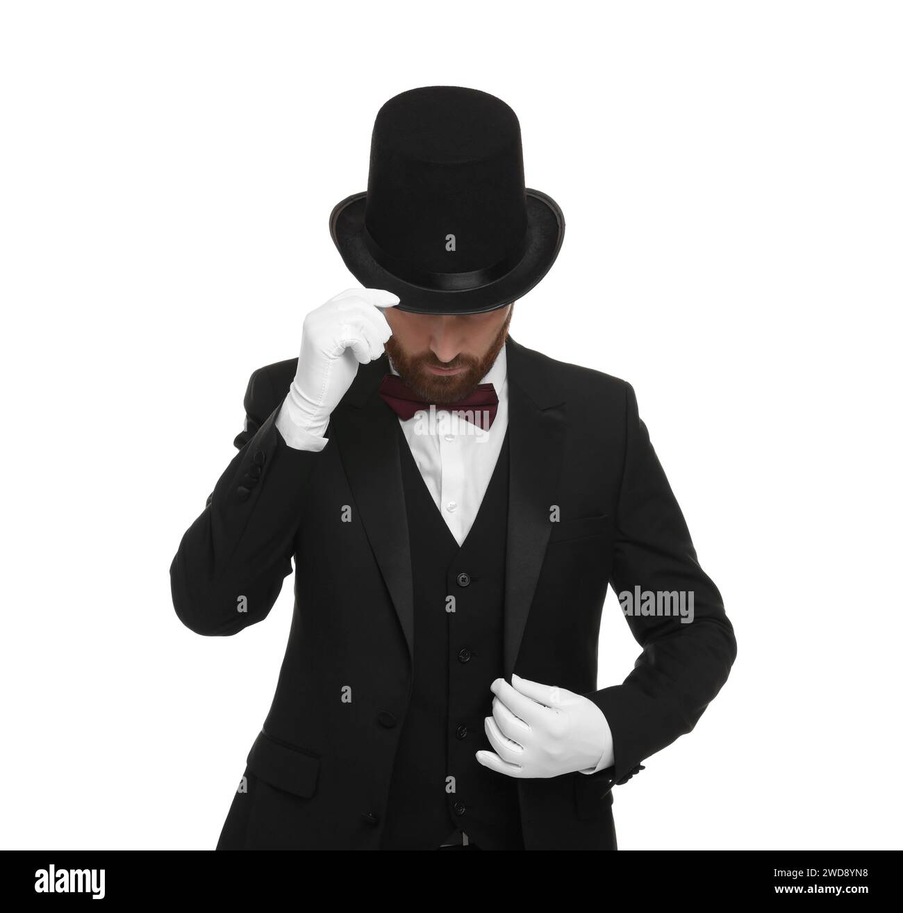 Magician in top hat on white background Stock Photo - Alamy